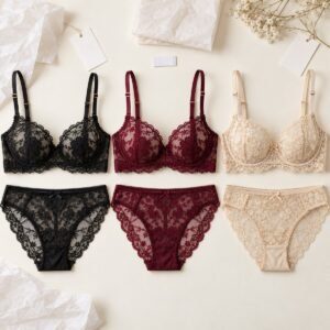Black burgundy champagne lace bra set flatlay with custom woven label – OEM lace lingerie manufacturer from 50 pcs